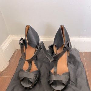 Black L.A.M.B leather pumps.